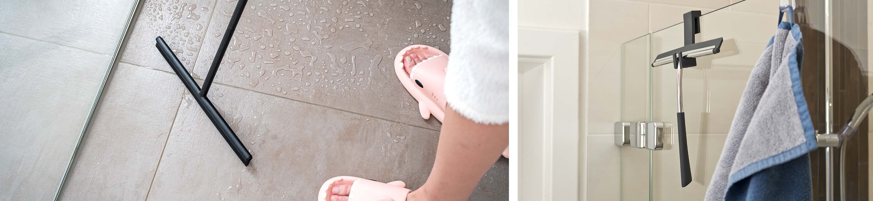 Eine Person mit rosa Hausschuhen steht auf einem gefliesten Boden mit Wasserflecken. Rechts hängt ein Handtuch an einem schwarzen Handtuchhalter.